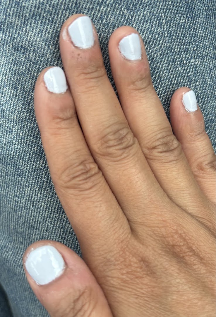 Manicured nails on display at a nail salon.